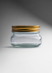 Frasco de vidrio transparente con tapa dorada 150 ml