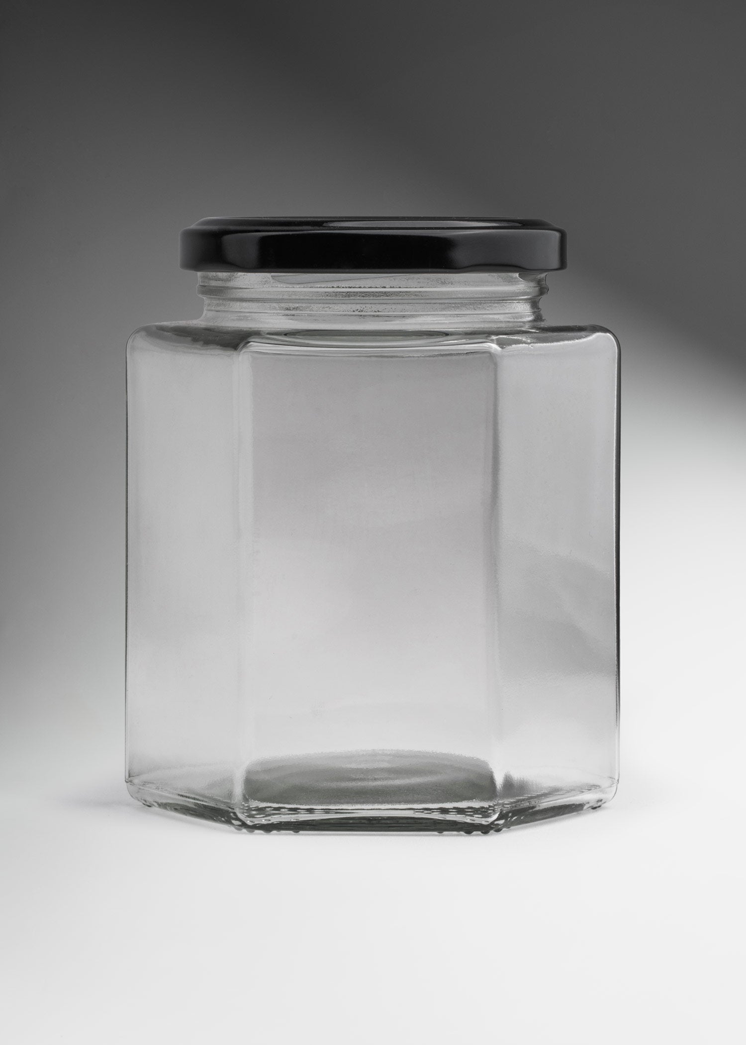 Frascos hexagonales de vidrio transparente con tapa negra uso alimenticio 380 y 500 ml