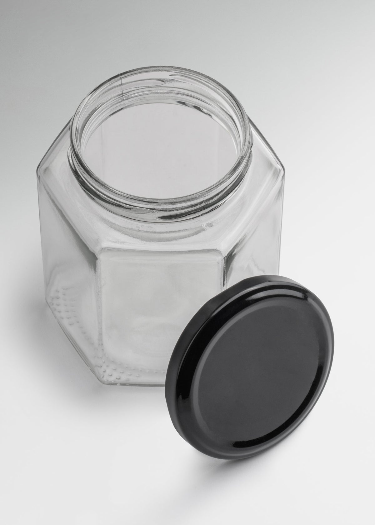 Frascos hexagonales de vidrio transparente con tapa negra uso alimenticio de 45 a 500 ml