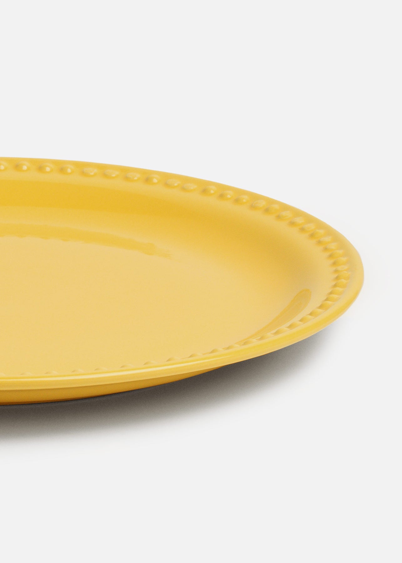 Vista frontal del plato trinche amarillo Monet de 27 cm