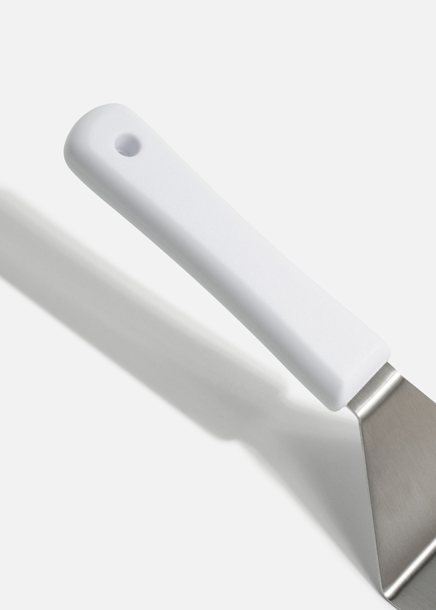 Volteador de cocina para pizza de acero inoxidable con mango de nylon blanco 8"x 3". Premium